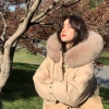 A mid-length down jacket for women in 2025 winter, featuring a fashionable fur collar and a Korean-style design. It is thickened, loose and warm details Picture
